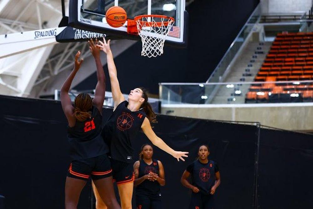 one player shoots over another player in practice for princeton