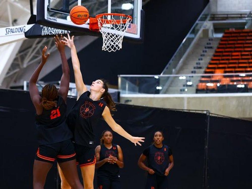 one player shoots over another player in practice for princeton