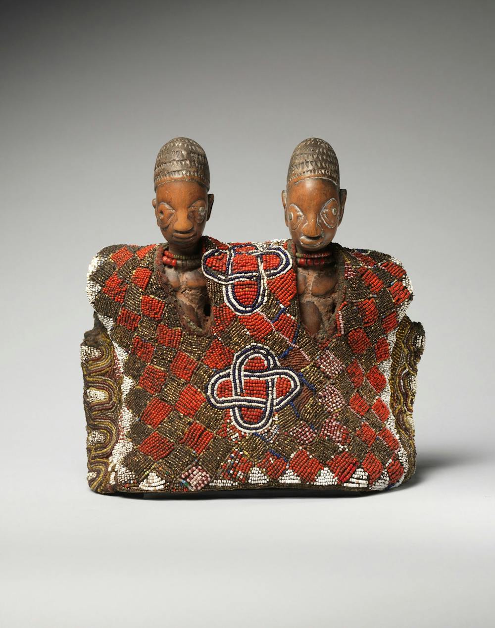 Twin commemorative figures with tunic