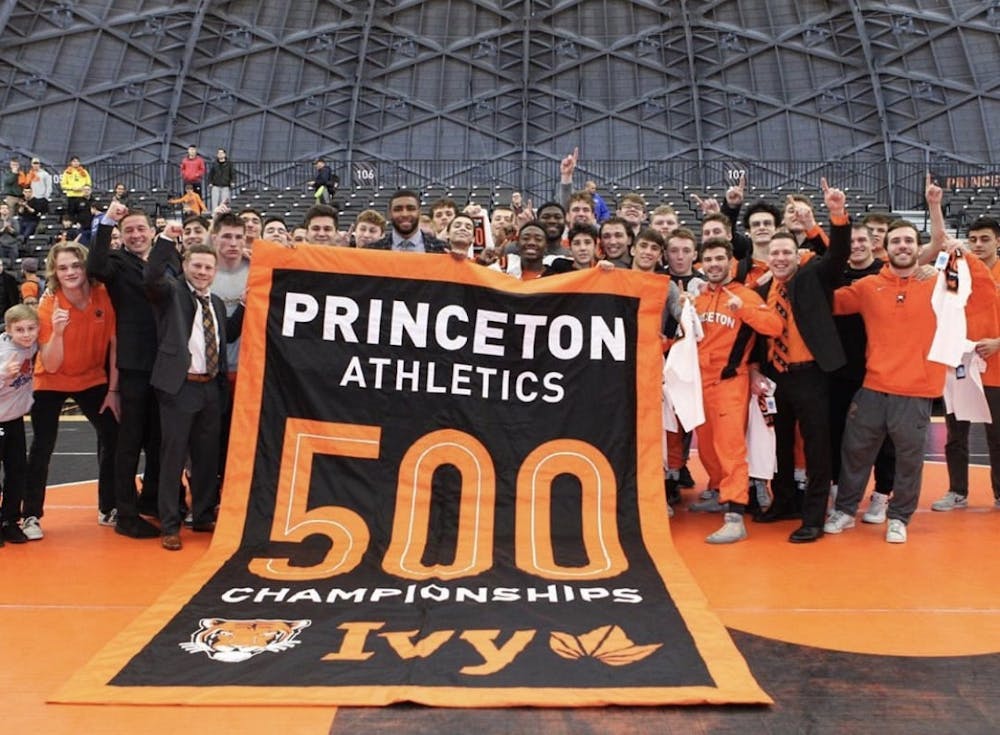 <p>Princeton wresting holding the 500 Ivy League Championships banner after their Ivy League Championship against Cornell.</p>
<h6>Photo Courtesy of <a href="https://www.instagram.com/princetonathletics/" target="_self">@princetonathletics</a> Instagram account</h6>