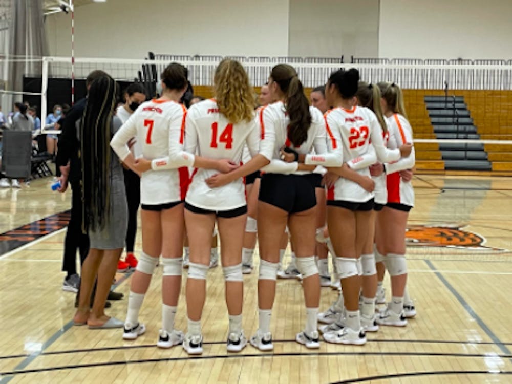 The team huddles up in their game against Columbia, one of two weekend wins.
Erin Lee / The Daily Princetonian