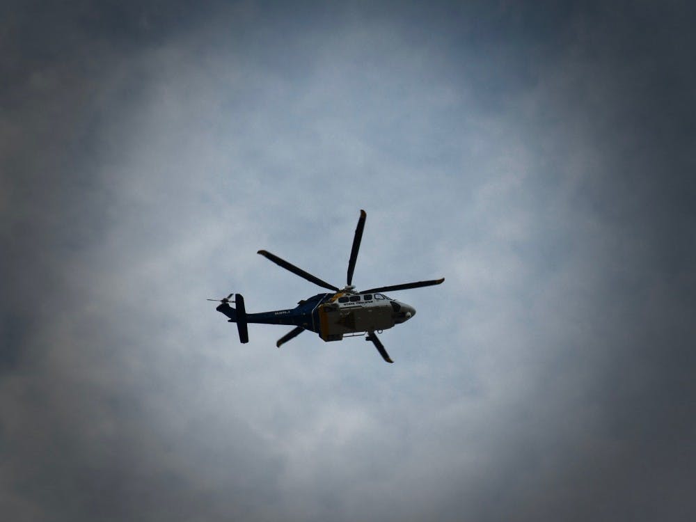 Police helicopter flies over counterprotest in Palmer Square