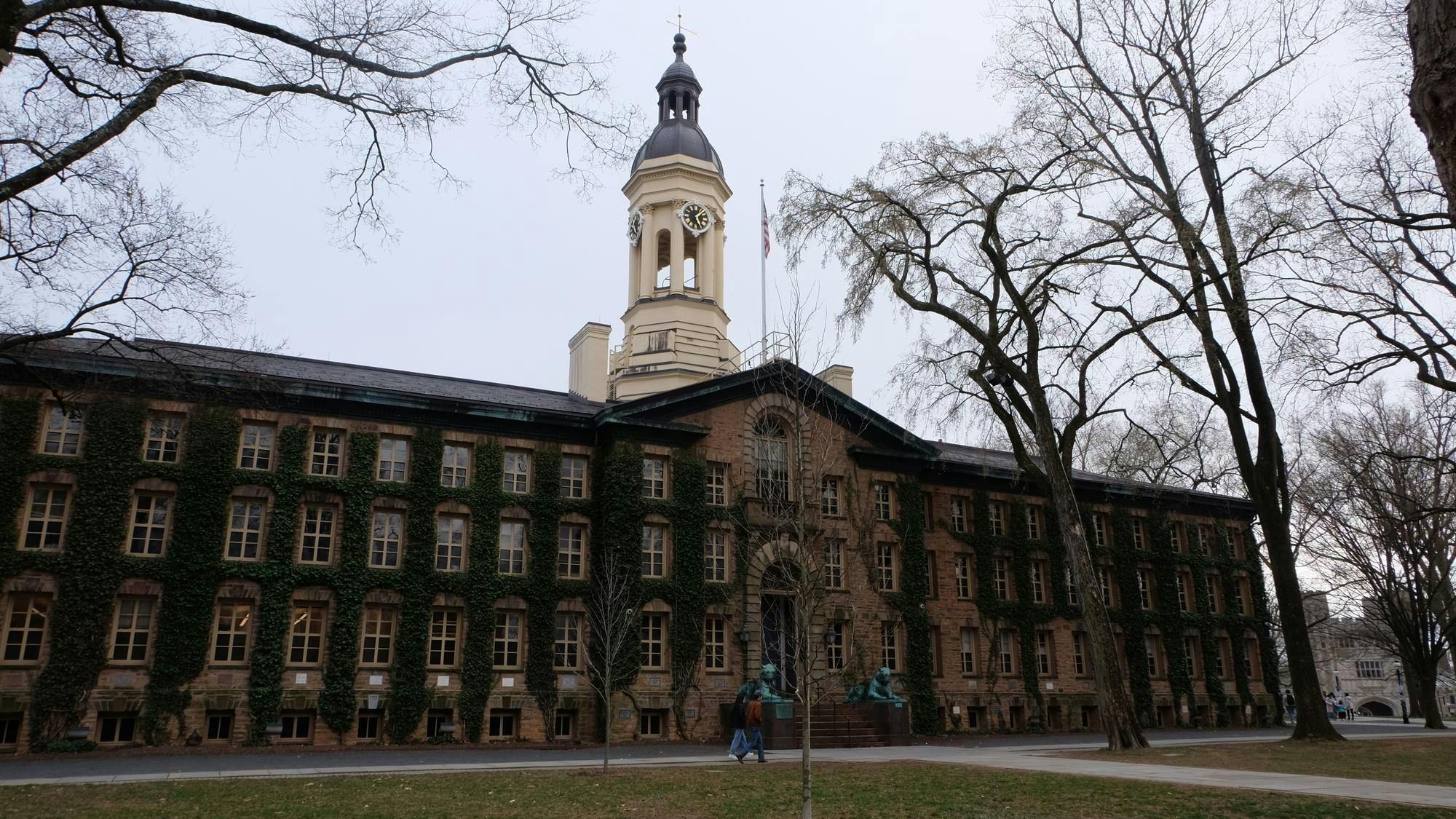 Colonial building with ivy running up its exterior walls.