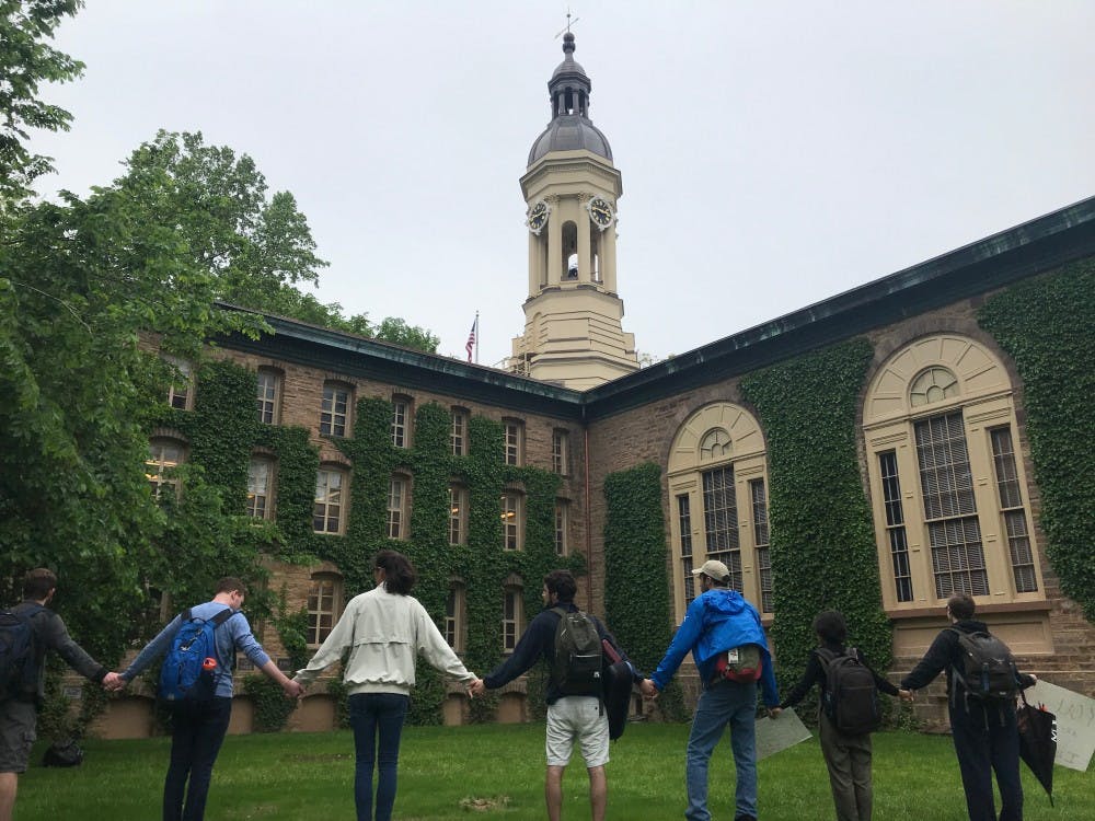 Students protesting the University’s Title IX policy in May 2019 form a circle around Nassau Hall.
Claire Silberman / The Daily Princetonian