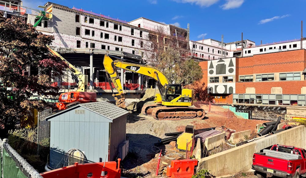 An excavator and truck in an active construction site.