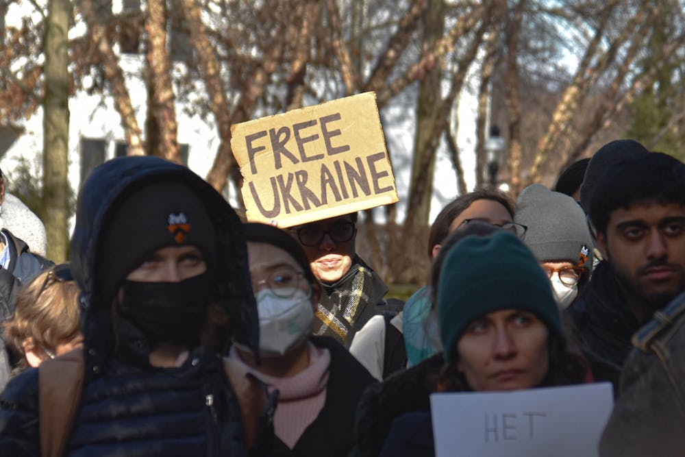 <h5>Community members gather outside Nassau Hall on Friday, Feb. 25. One holds a sign reading “Free Ukraine.”</h5>
<h6>Mark Dodici / The Daily Princetonian</h6>