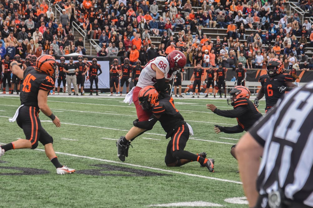 <h5>Powers Field was raucous, with total attendance over 10,000, as the Tigers outlasted the Crimson in a defensive battle that saw the referees play a rather conspicuous role.</h5>
<h6>Mark Dodici / The Daily Princetonian</h6>