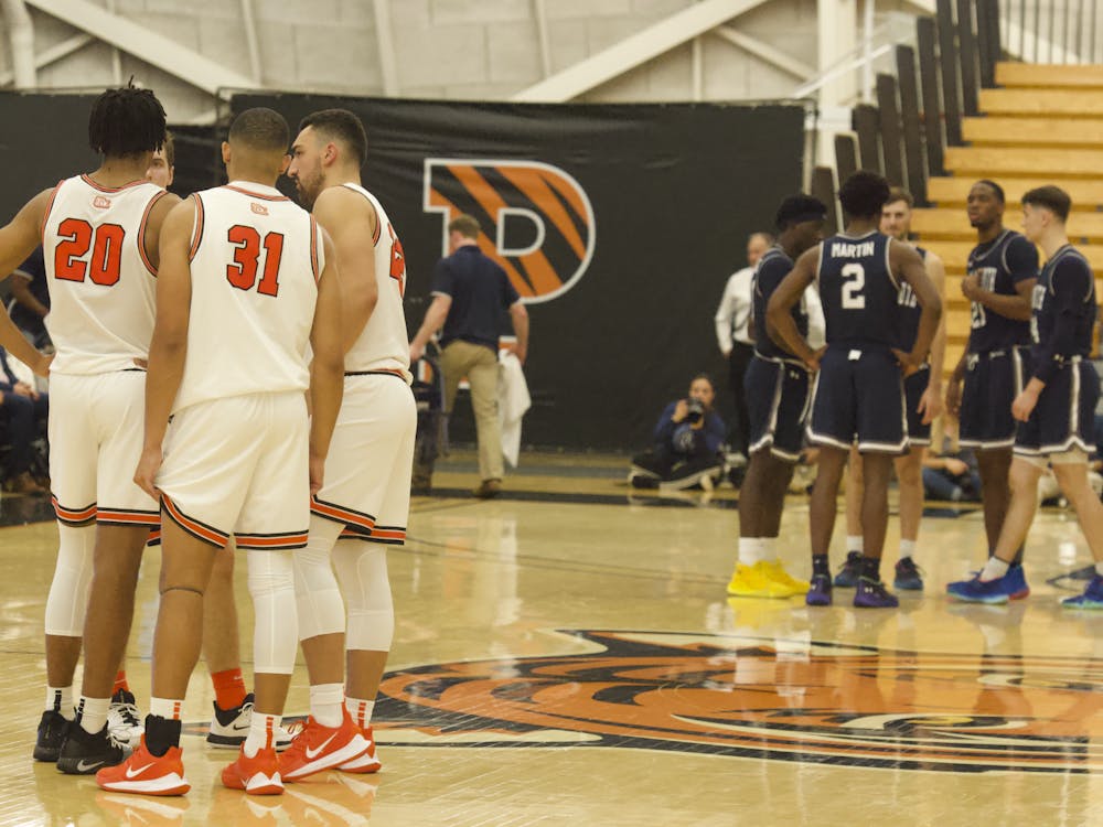 The Tigers huddle before starting the second half against Monmouth.
Photo Credit: Tom Salotti / The Daily Princetonian