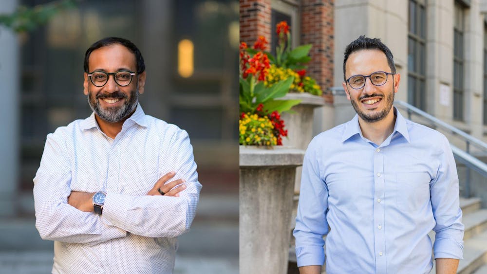 Two men in two separate photos on the left and right; both are wearing glasses and dress shirts and smiling