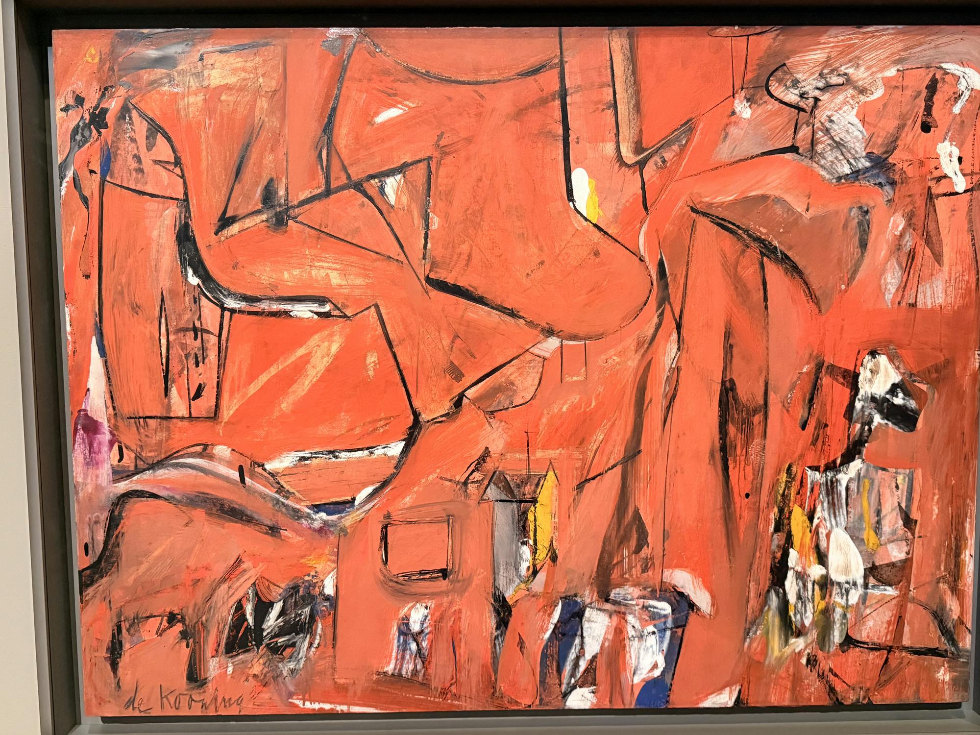An abstract painting using shades of red and black.