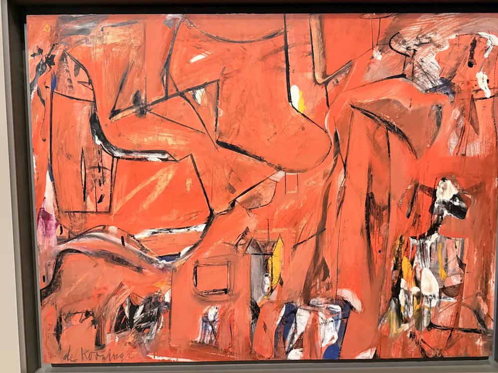 An abstract painting using shades of red and black.