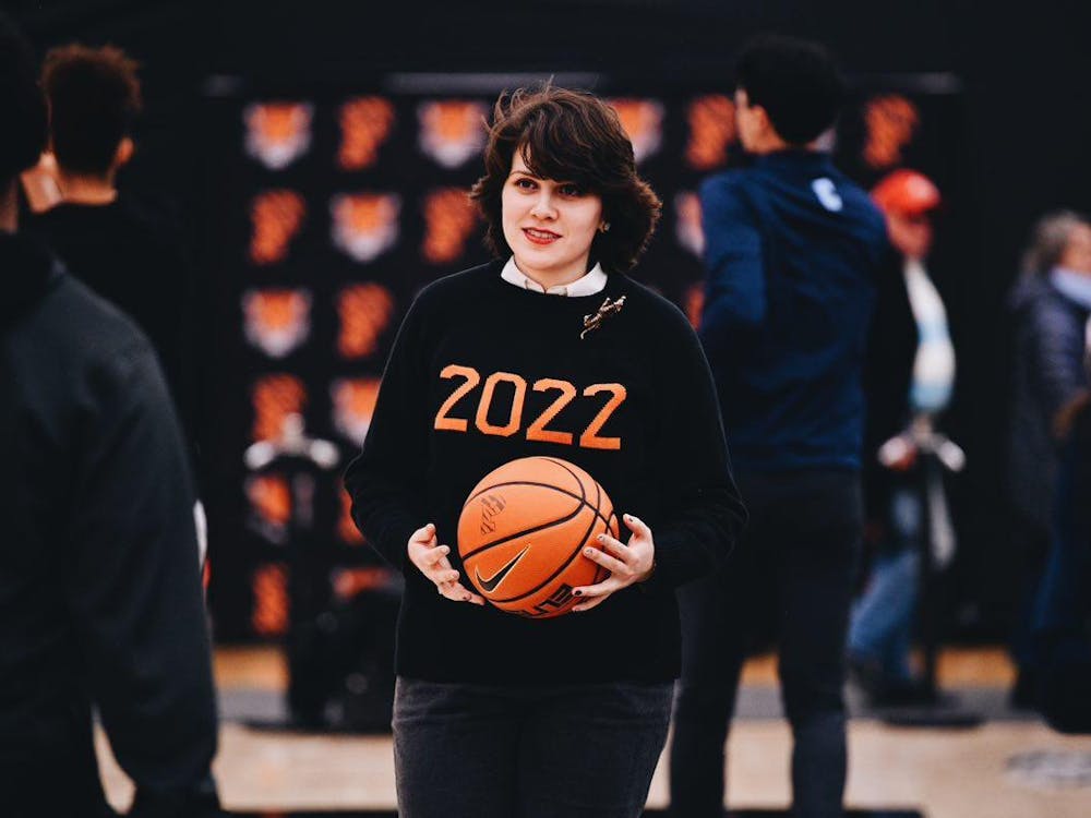 A woman holding a basketball.