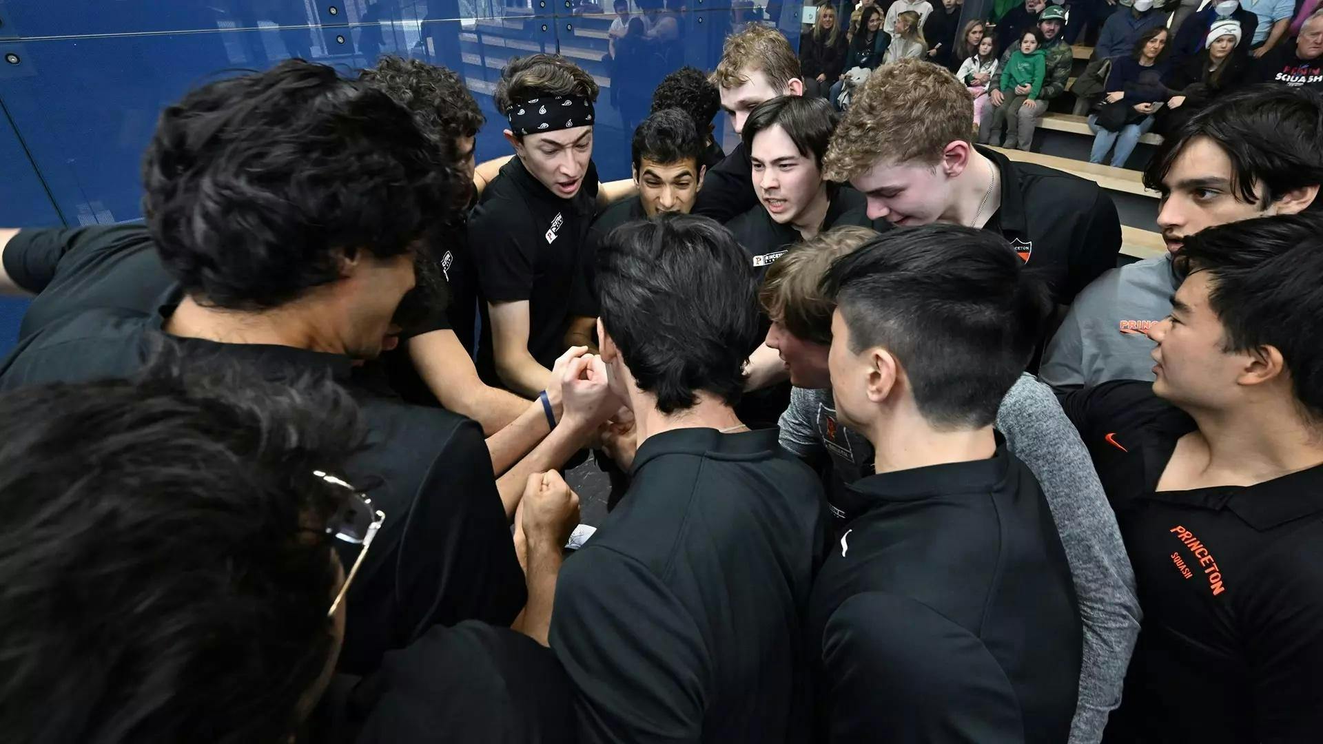 Players in black shirts huddle up 