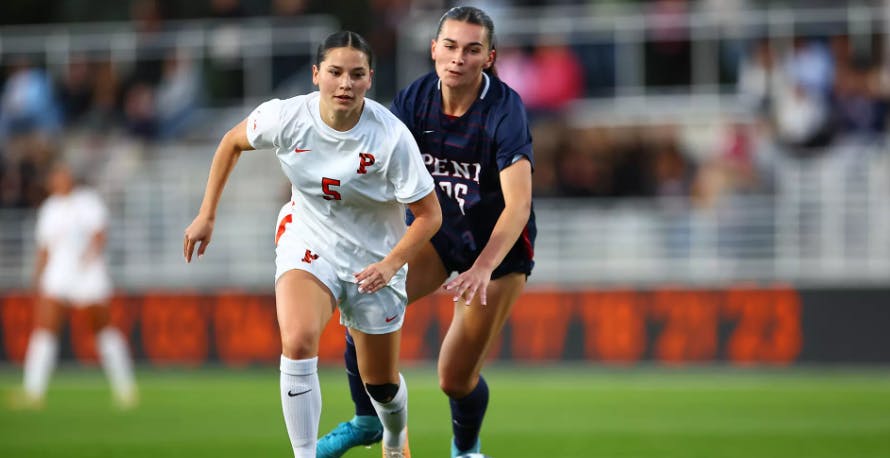 Princeton women's soccer player dribbling ball.