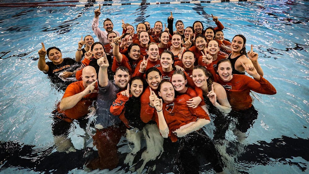 Caption: Women's swimming and diving participating in the Ivy League champion tradition: jumping into the pool as a team.

Credit: The Ivy League