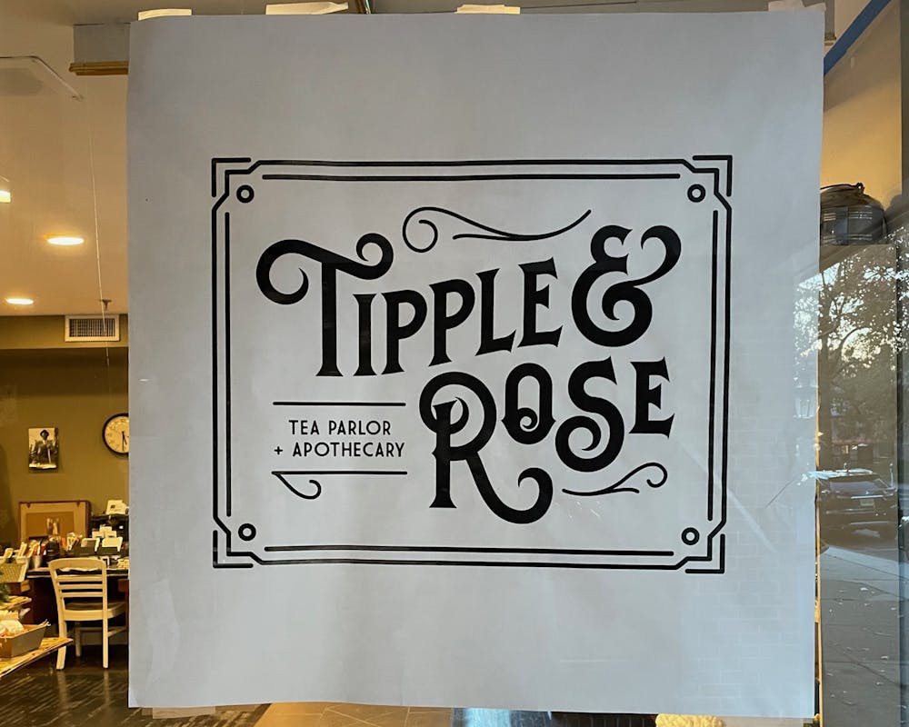 <h5>Tipple &amp; Rose Tea Parlor and Apothecary's front door sign</h5>
<h6>Maria Khartchenko / The Daily Princetonian</h6>