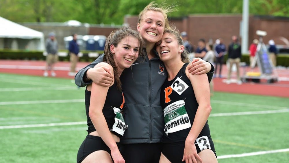 Anna Jurew, Madeleine Sumner and Jackie Berardo stand together after winning the 4x8 relay.&nbsp;