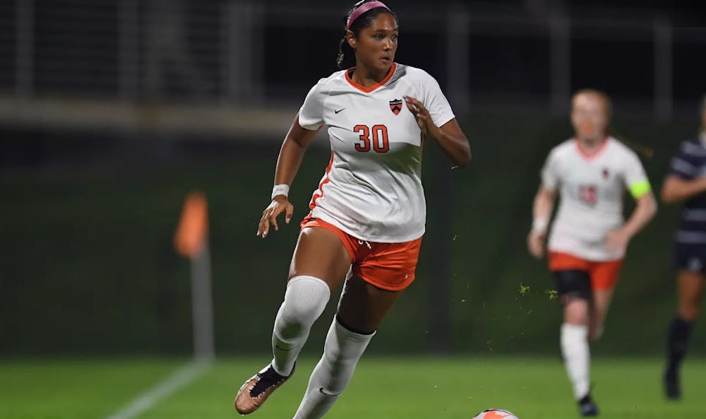 Princeton women's soccer player dribbling the ball