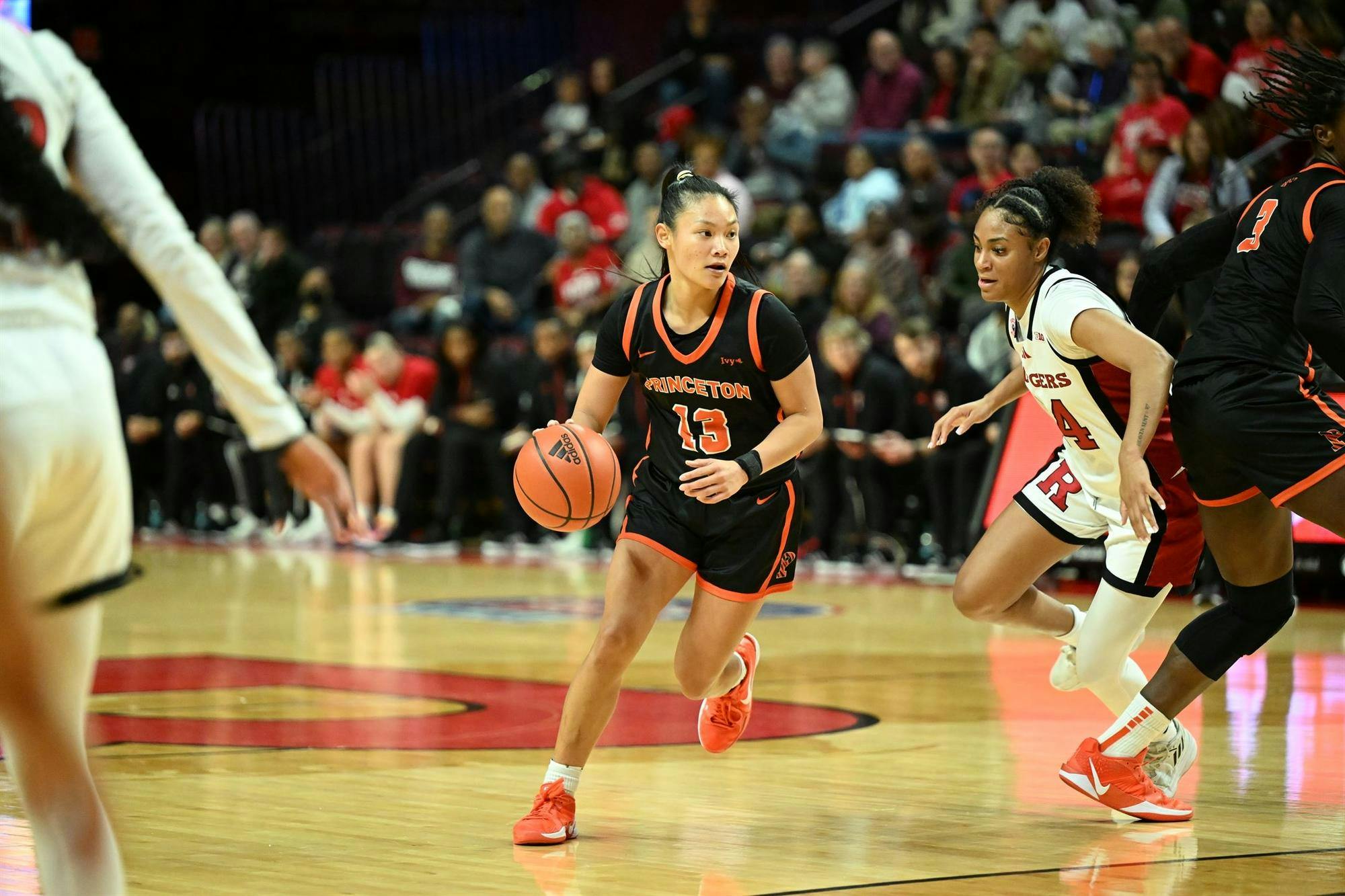 Woman playing basketball.