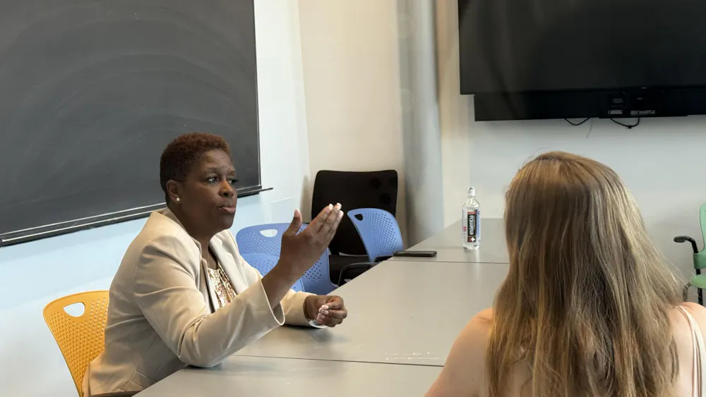 A photo of two women sitting at a table.