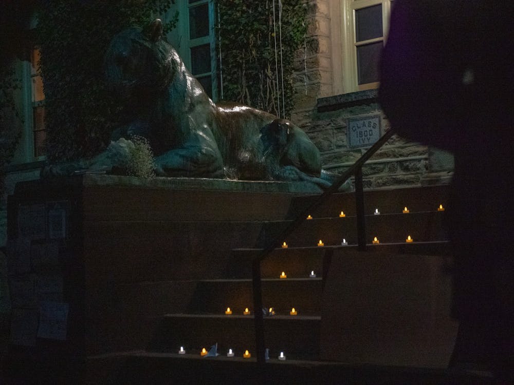 <h5>Candles sit on the steps of Nassau Hall at a vigil for the victims of a fire in a building in the Xinjiang region of China.</h5>
<h6>Candace Do / The Daily Princetonian</h6>