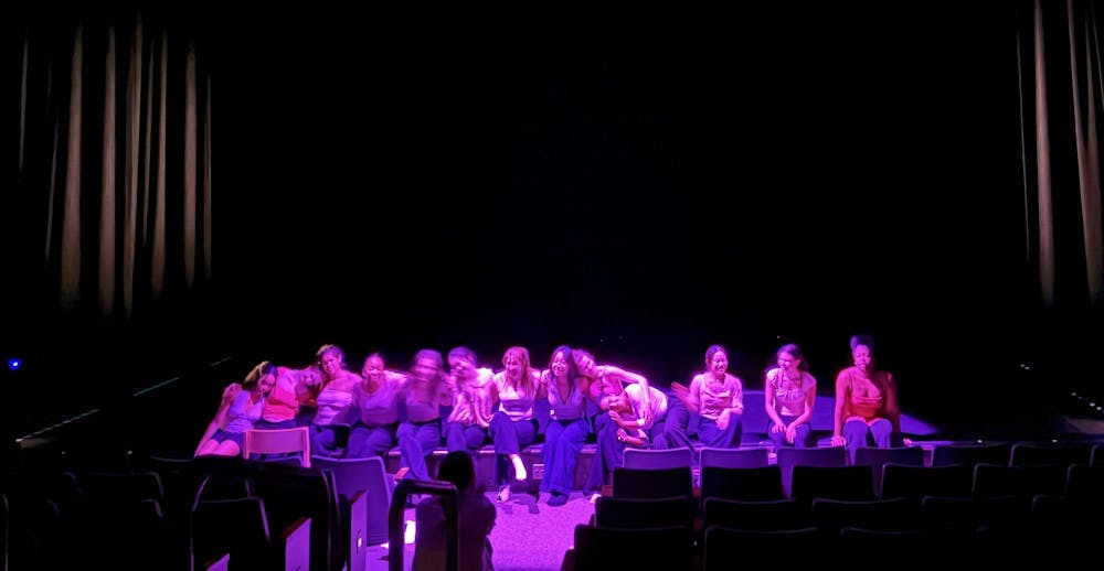 A group of eXpressions dancers line the stage.