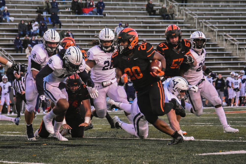 <h5>Senior running back Trey Gray rounds the corner early in the second half, finding a lane that would take him to the end zone for Princeton's fourth touchdown of the night.</h5>
<h6>Mark Dodici / The Daily Princetonian</h6>
