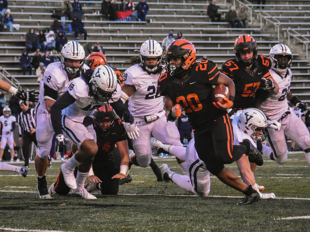 Senior running back Trey Gray rounds the corner early in the second half, finding a lane that would take him to the end zone for Princeton's fourth touchdown of the night.
Mark Dodici / The Daily Princetonian
