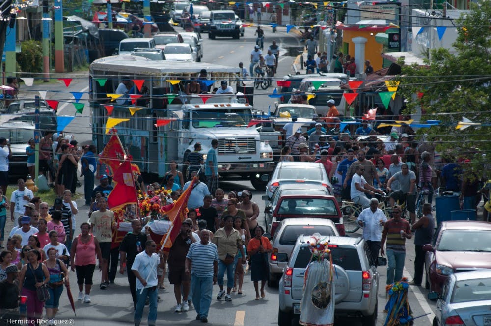 Followers of Santiago walking in Loíza during Las Fiestas de Santiago procession on July 26th, 2014.