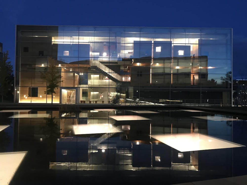 A modern looking building at night