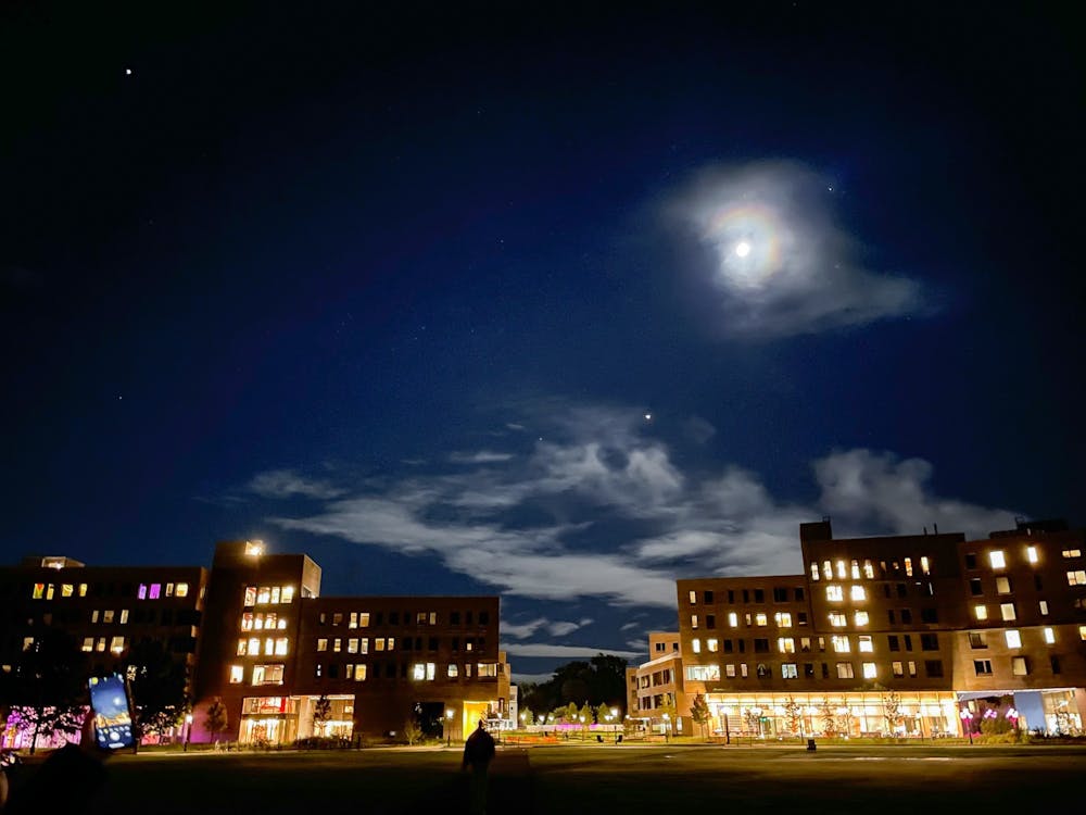 <h5>Students stop to watch the night sky lit with the moon and stars.&nbsp;</h5>
<h6>Keeren Setokusumo / The Daily Princetonian</h6>