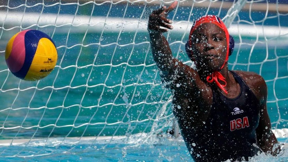 Ashleigh Johnson defends the goal against China