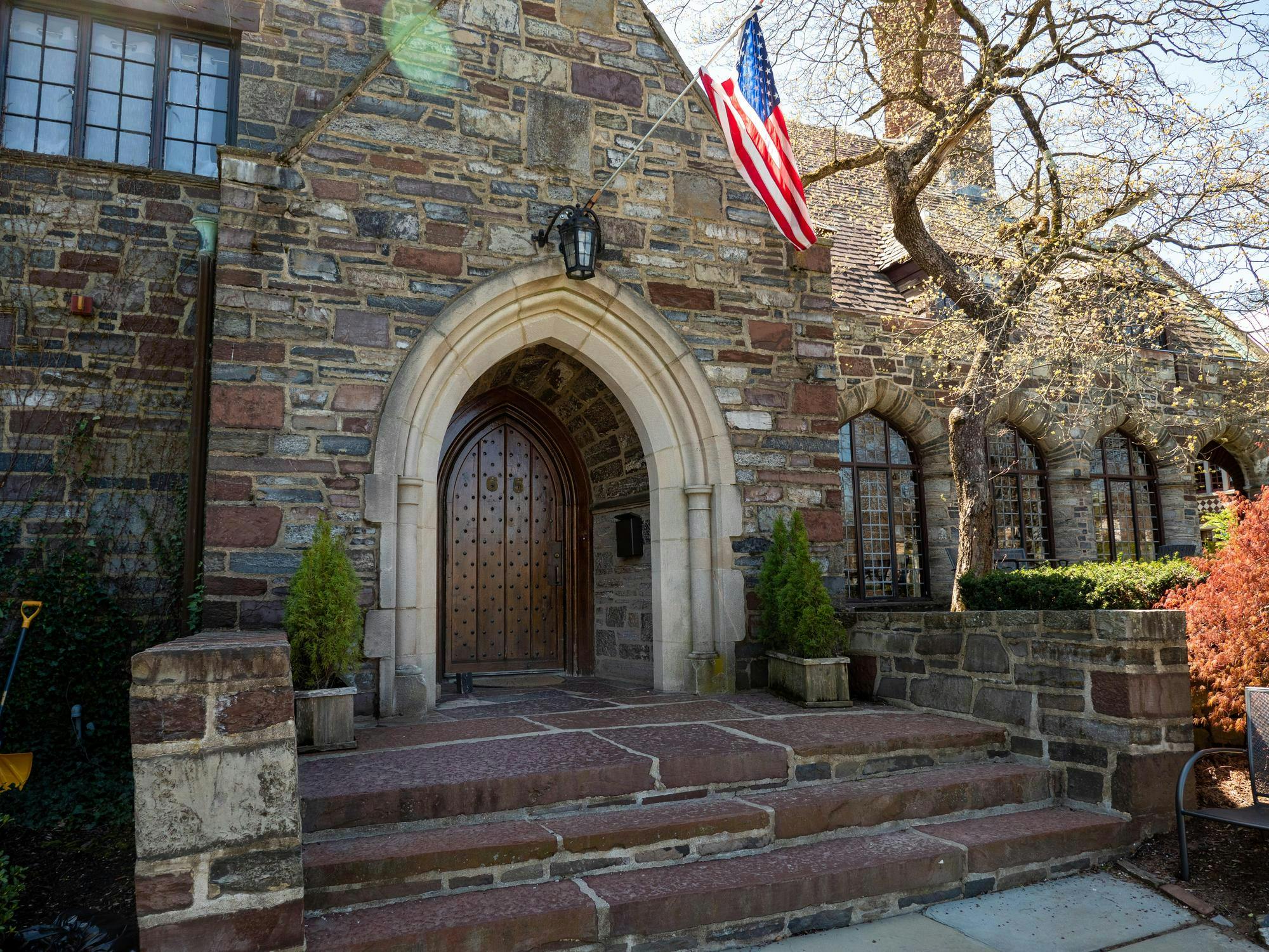 Facade of a building with an American flag over the entrance