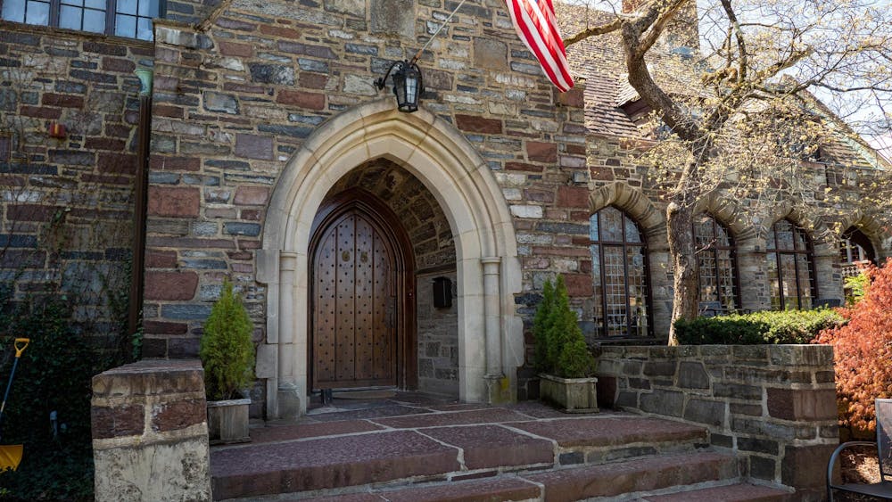 Facade of a building with an American flag over the entrance