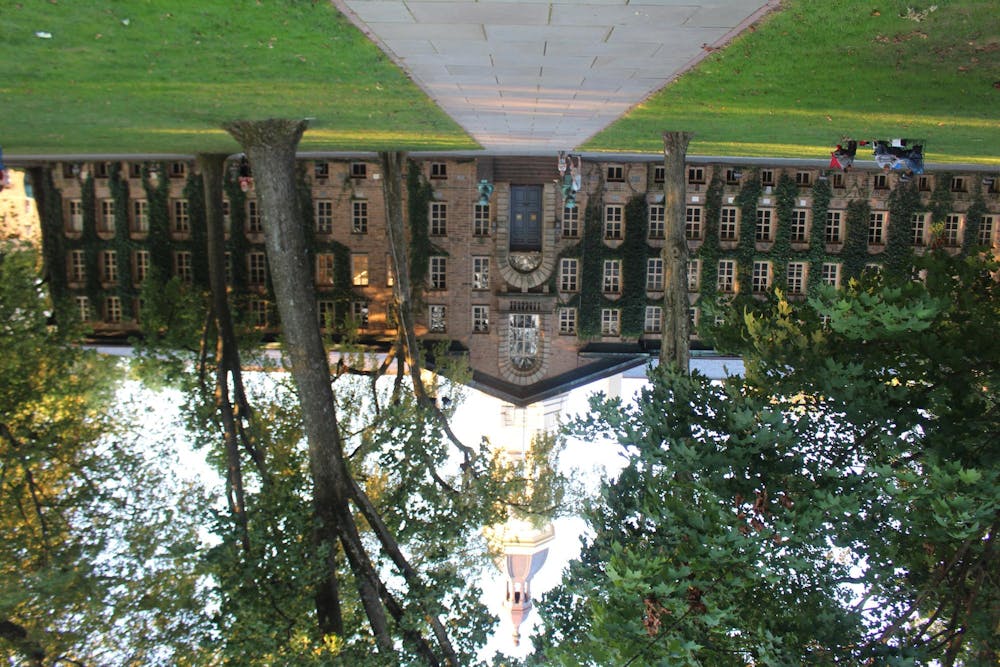 An upside down, ivy-covered building.