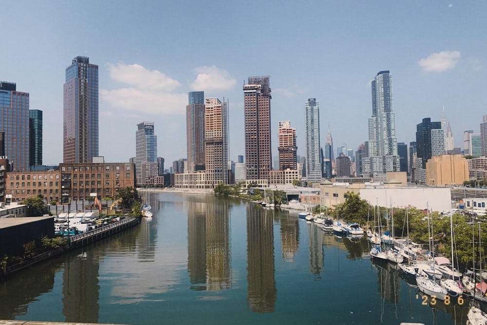 A view of a city skyline along the water.