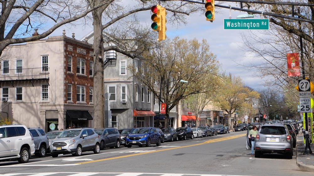 A road with cars. It’s a red light.