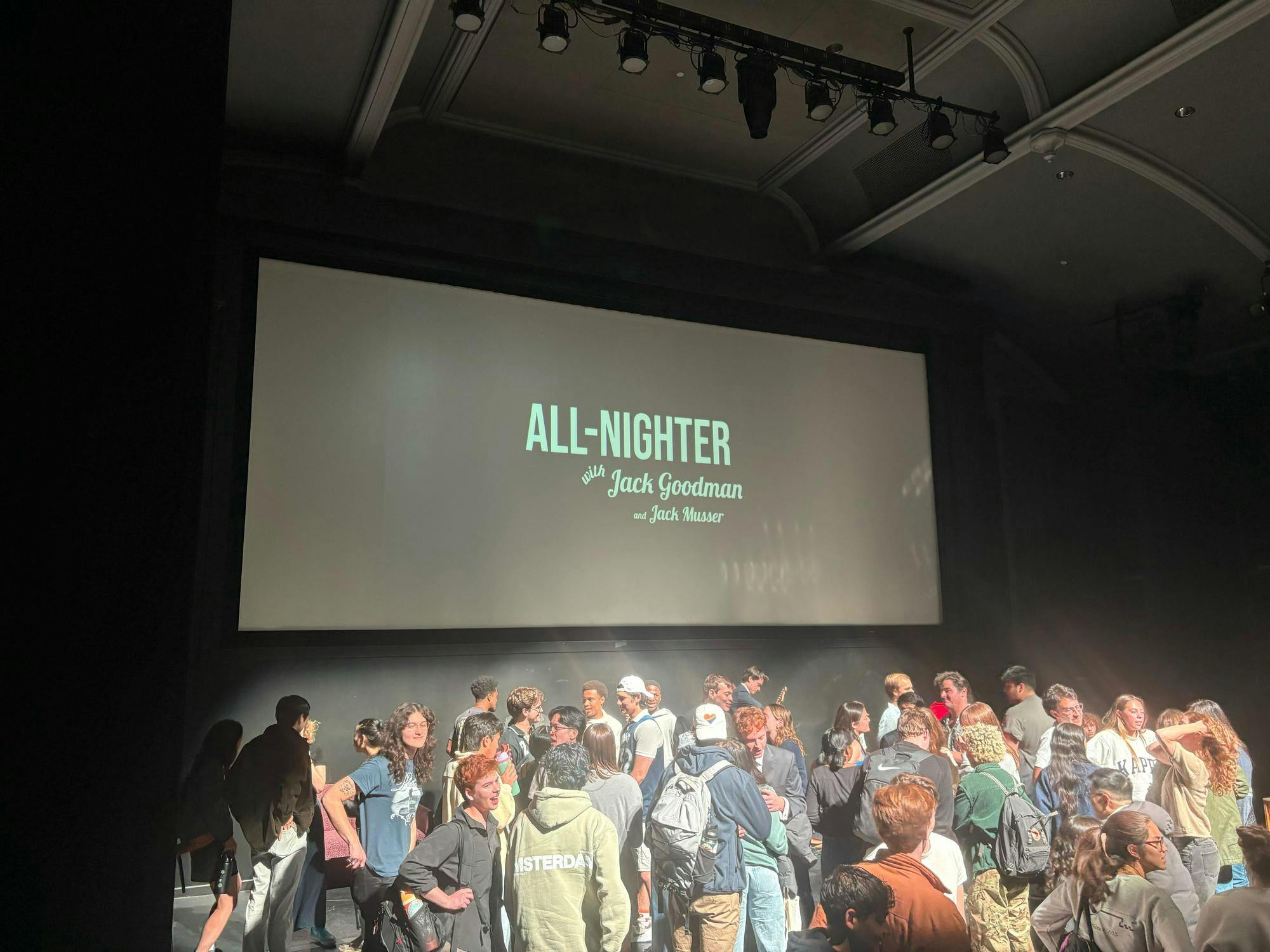 A crowd of individuals gather after the end of the All-Nighter show.