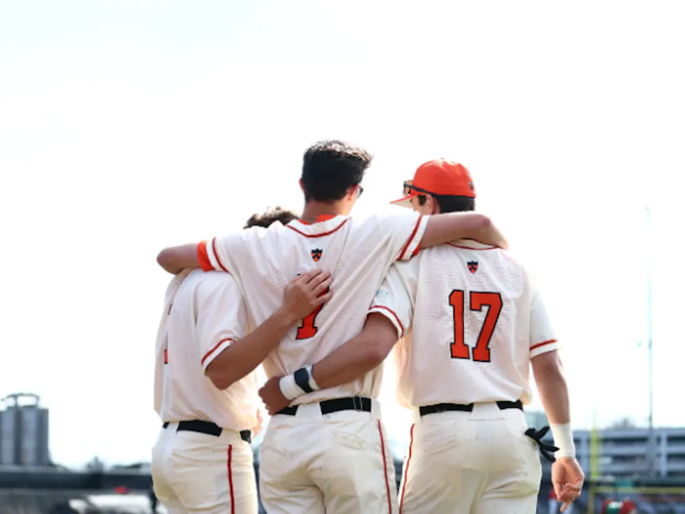 Princeton baseball players in a huddle.