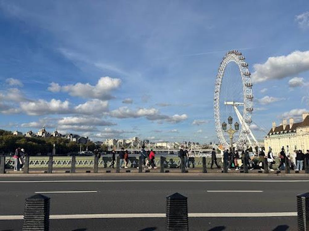 Blue sky with cloud and ferris wheel off to the right