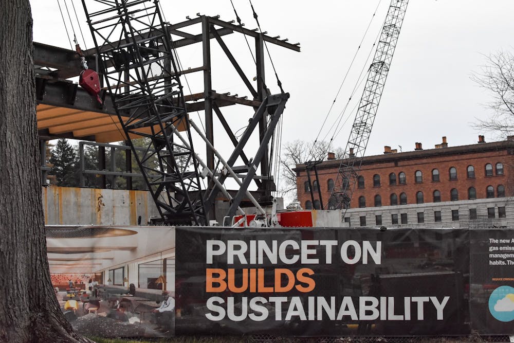 <h5>A sign on the fence surrounding construction describes the future benefits of the new art museum.</h5>
<h6>Angel Kuo / The Daily Princetonian</h6>