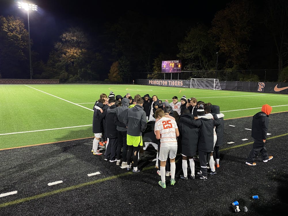 <h5>The soccer team huddles before the start of the OT period against Yale.</h5>
<h6>Julia Nguyen / The Daily Princetonian.</h6>