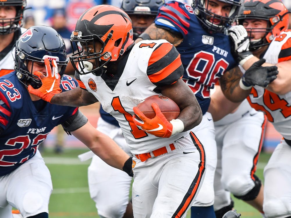 Caption: Eaddy running the ball against UPenn

Credit: Beverly Schaefer, goprincetontigers.com
