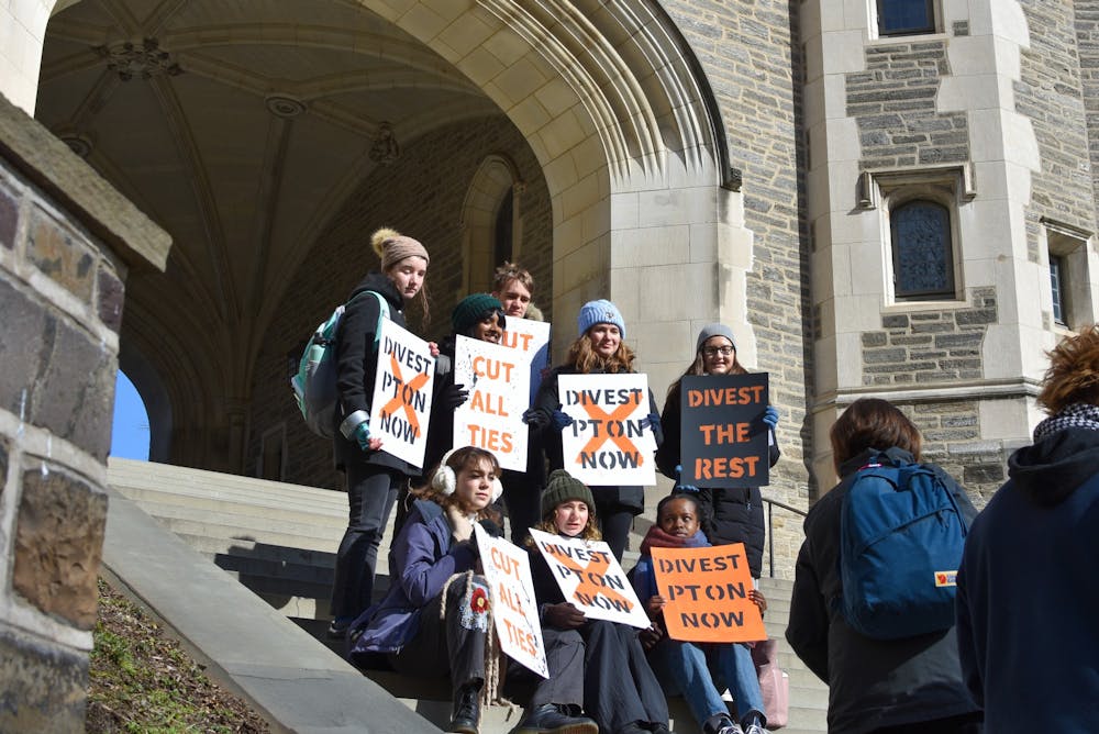 <h5>Even on a day below freezing, Divest Princeton holds a demonstration in front of Blair Arch.</h5>
<h6>Angel Kuo / The Daily Princetonian</h6>