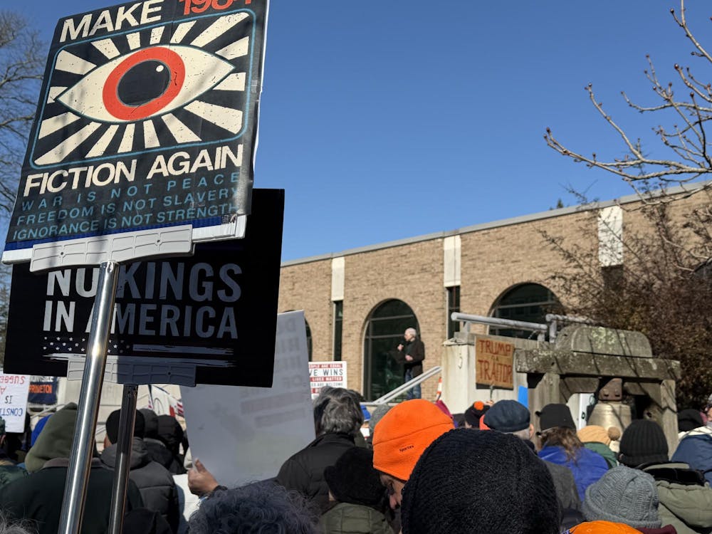 Protesters hold 'No Kings in America' signs. 