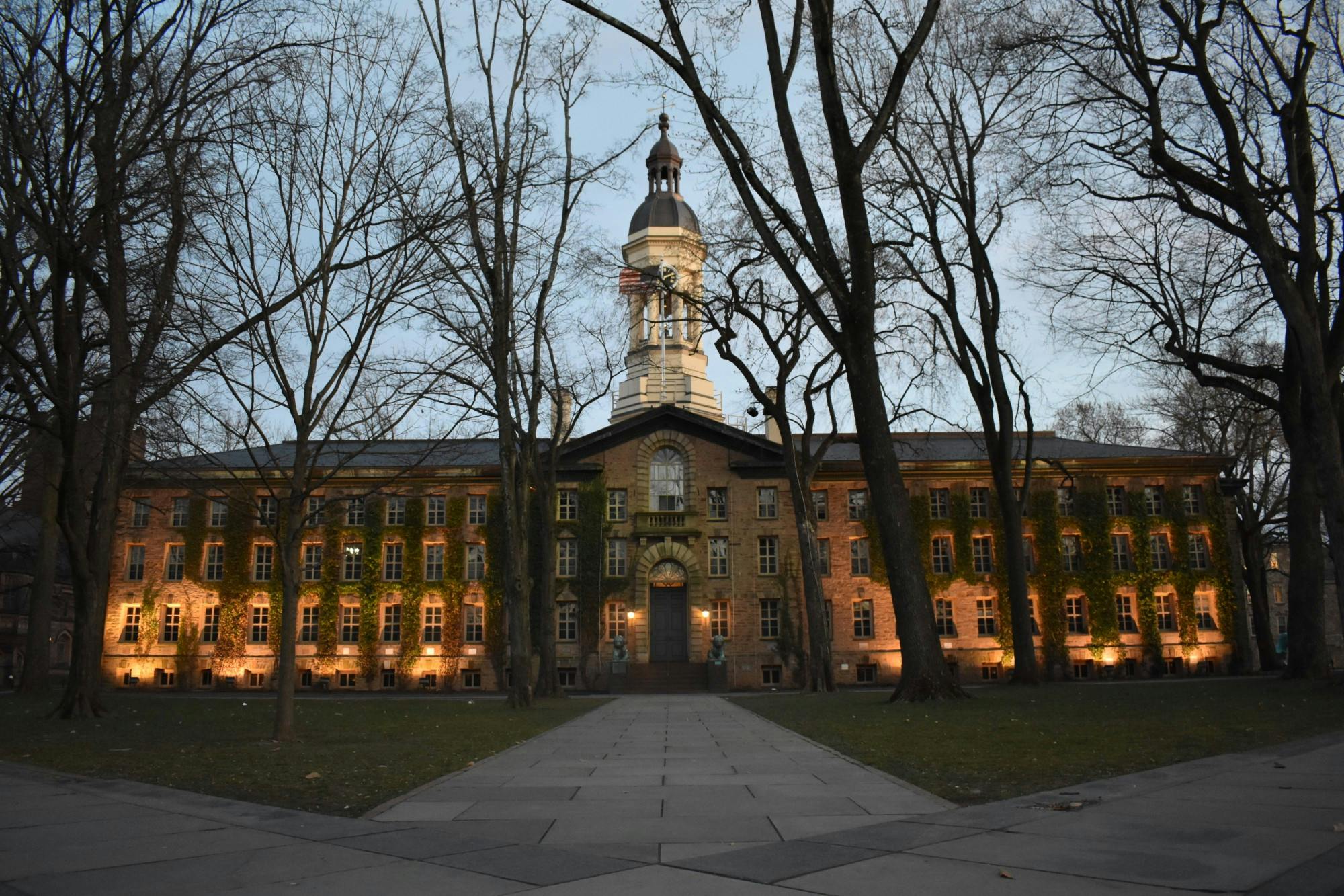 A building at night time illuminated from the front.