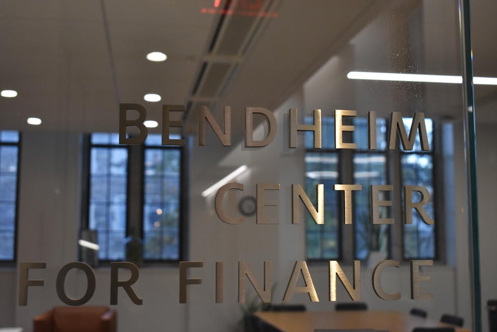 A glass door that reads "Bendheim Center for Finance."