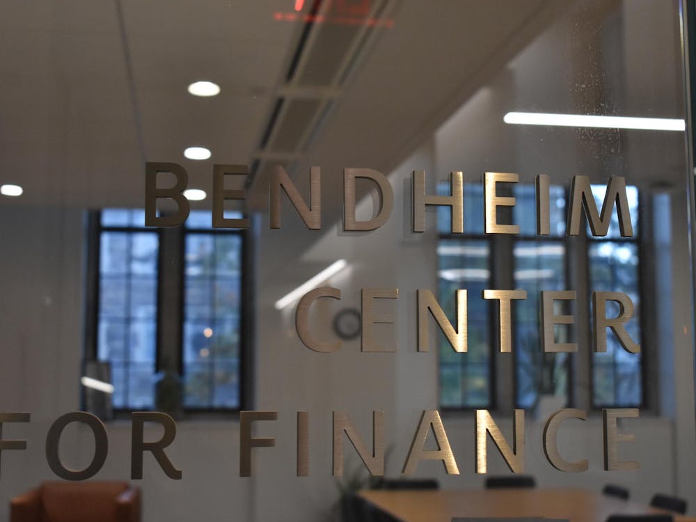 A glass door that reads "Bendheim Center for Finance."