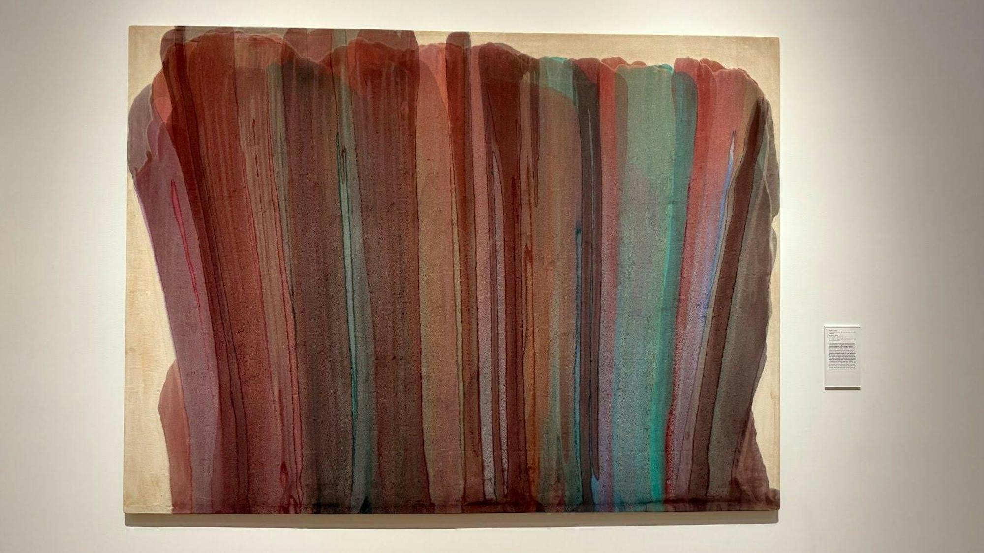 A painting of dark hues of reds and blues in overlapping vertical layers.