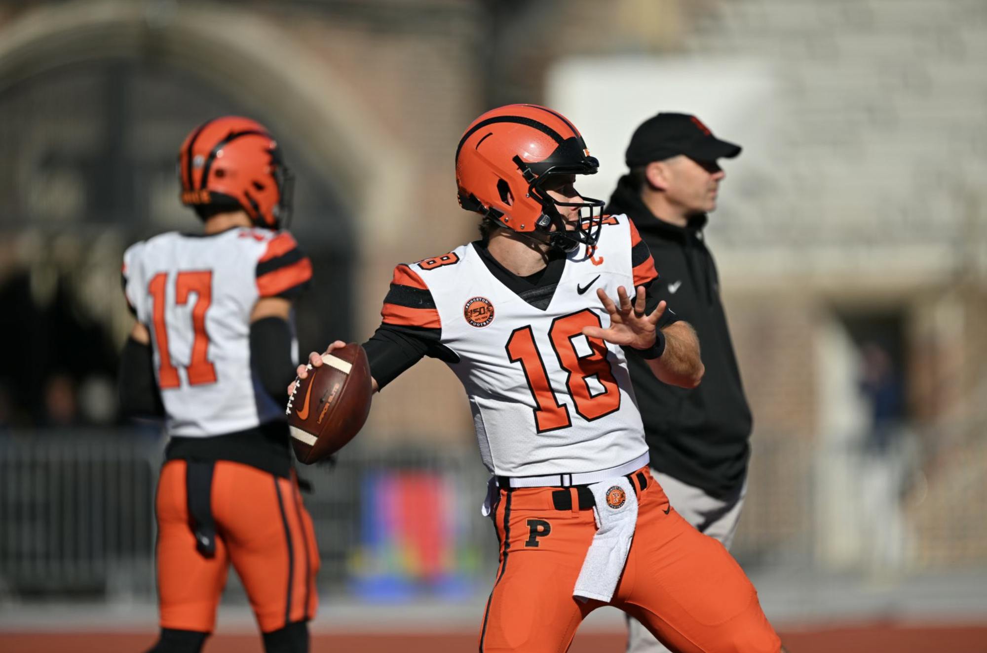 Stenstrom pulls arm back with football in right hand to throw